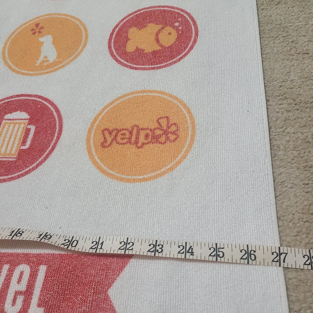 Elite 2014 White Beach Towel with Red and Yellow Icons